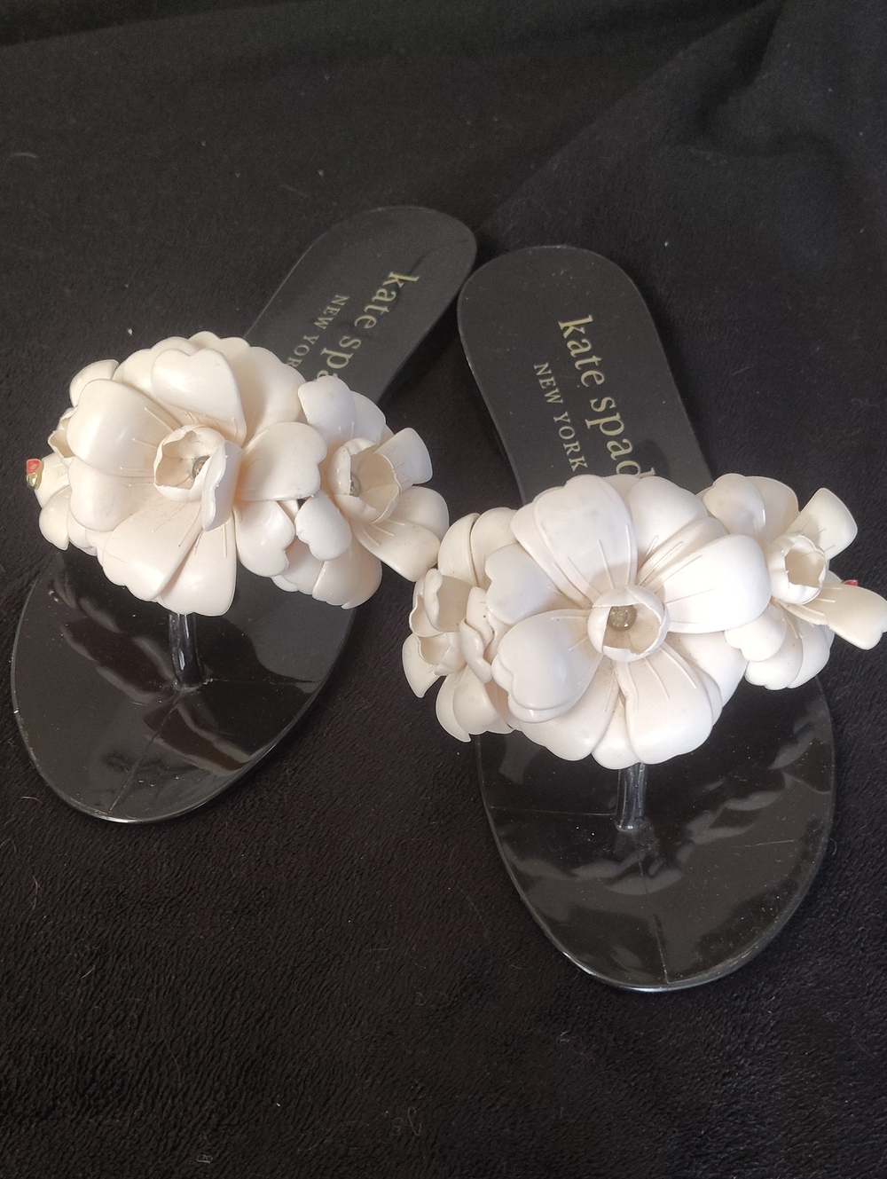 kate spade Black Jelly Thong Sandals with White Floral Appliqués